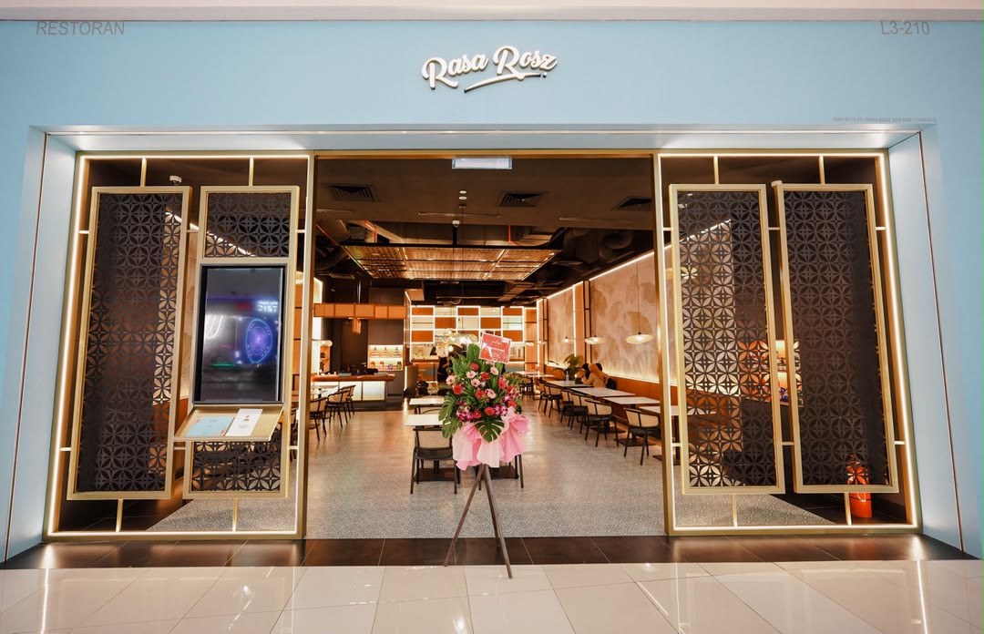 Rasa Rosz storefront at IOI City Mall, Putrajaya, with its pale-blue sign and decorative entrance panels